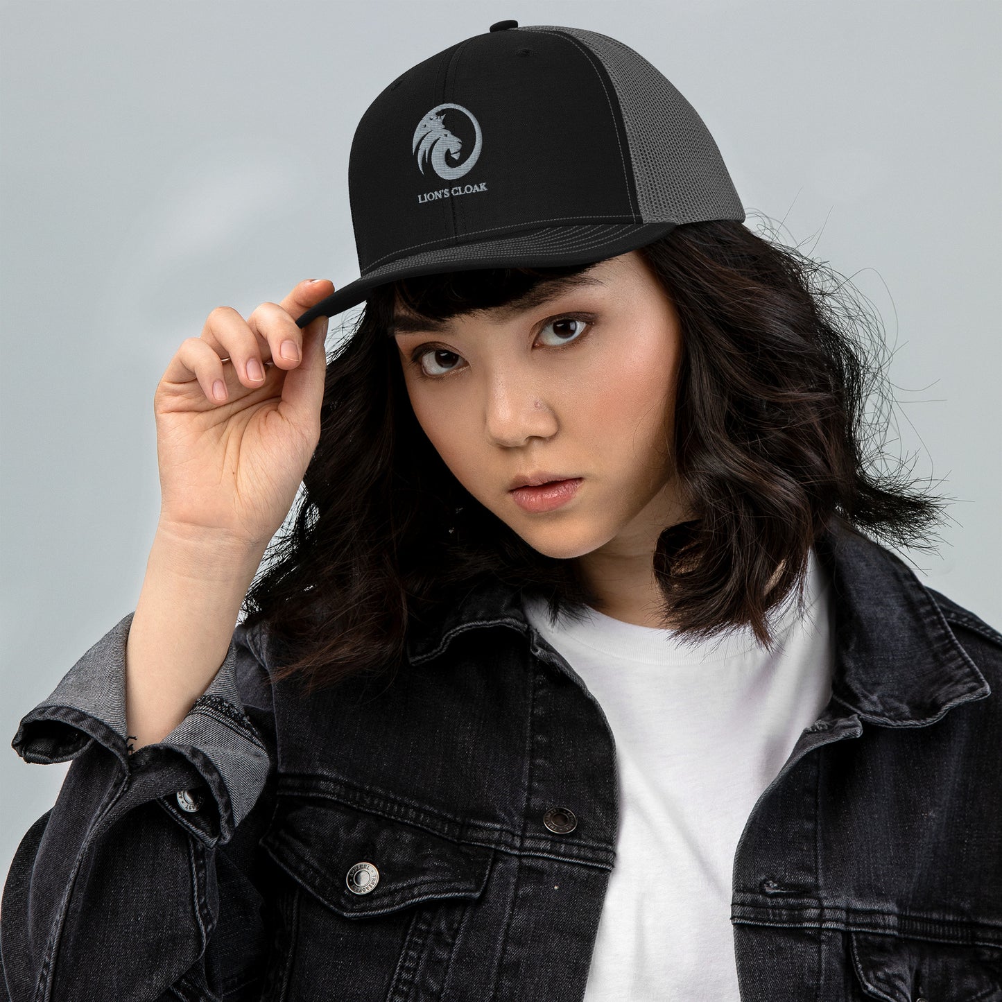 Embroidered Trucker Cap With Lion's Cloak Logo